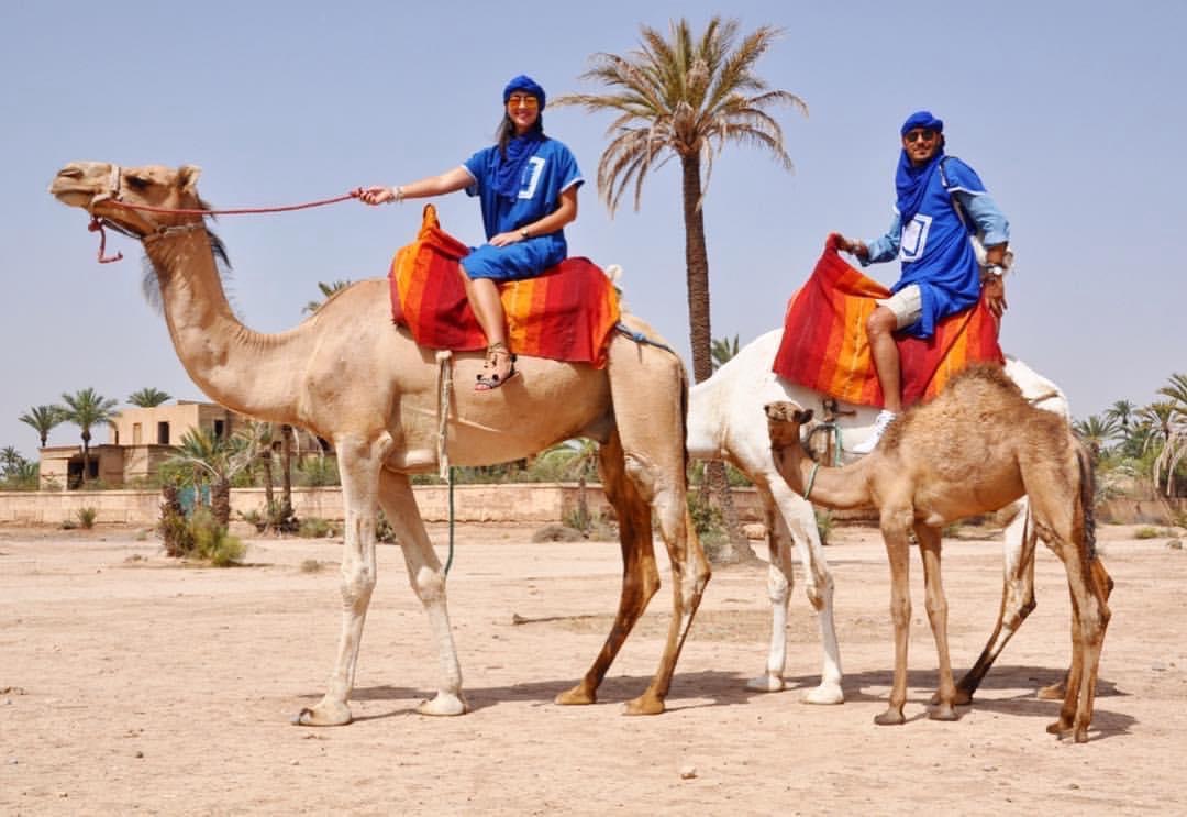 Camel riding in traditional Moroccan setting
